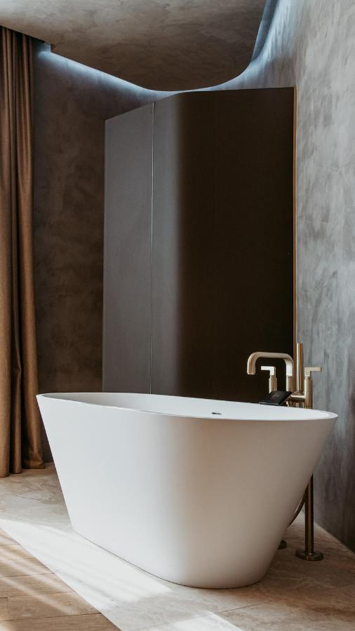 The Veil Hotel Astana Extérieur photo A modern freestanding bathtub