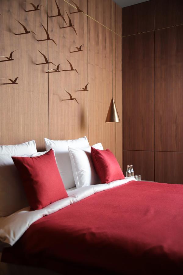 The Veil Hotel Astana Extérieur photo A bed with cushions