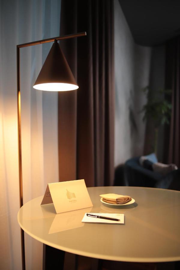 The Veil Hotel Astana Extérieur photo A floor lamp