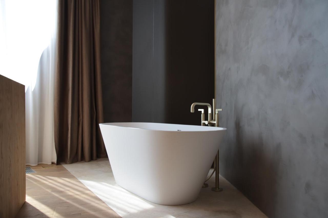 The Veil Hotel Astana Extérieur photo A freestanding bathtub